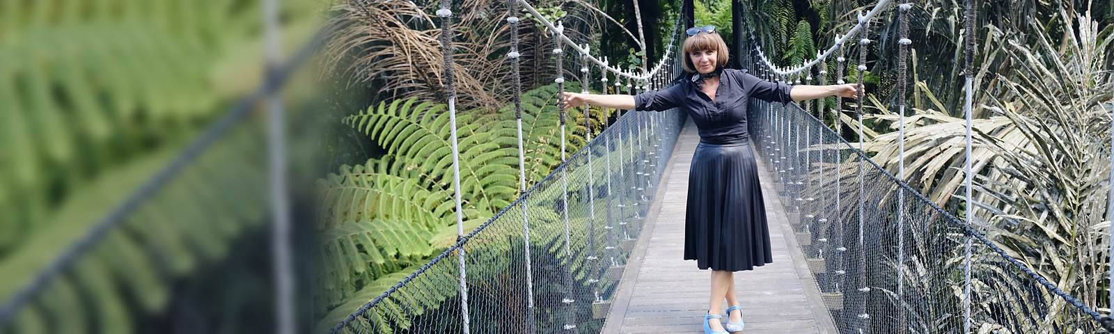 Carole Favre on a suspension bridge in the jungle